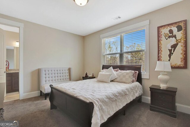bedroom featuring baseboards, visible vents, and carpet floors