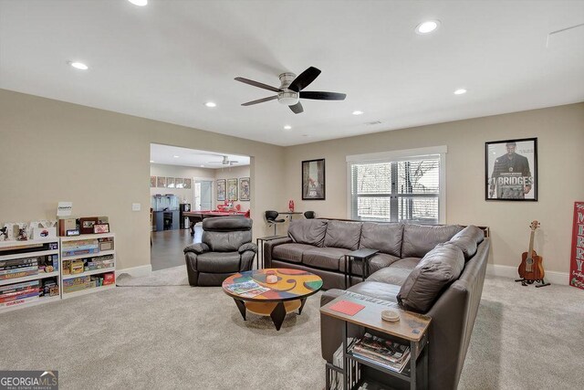 carpeted living area with baseboards, a ceiling fan, and recessed lighting