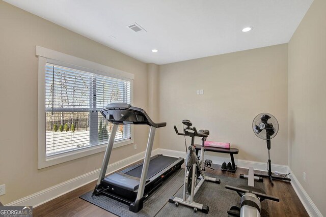 workout room featuring visible vents, baseboards, recessed lighting, and wood finished floors