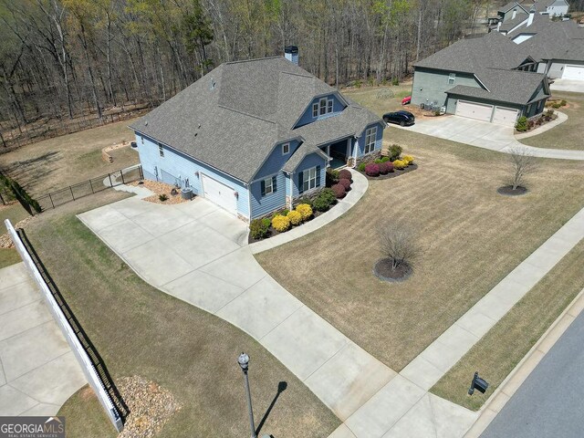 bird's eye view featuring a wooded view