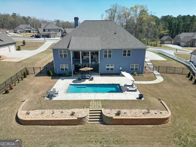 rear view of house featuring stairs, a patio, and a fenced backyard