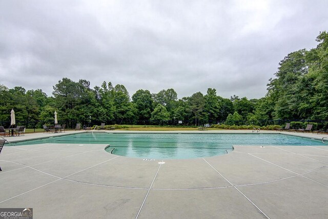 pool with a patio