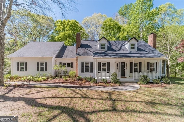 3775 Belle Glade Trl, Snellville, GA 30039 - cape cod-style house featuring a chimney, a porch, and a front lawn