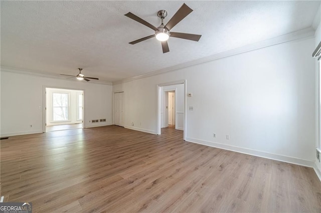3775 Belle Glade Trl, Snellville, GA 30039 - spare room with a ceiling fan, crown molding, a textured ceiling, and light wood-style floors
