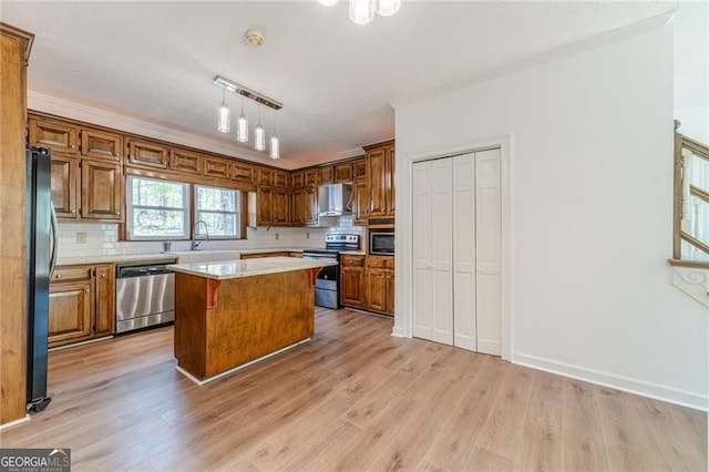 3775 Belle Glade Trl, Snellville, GA 30039 - kitchen with appliances with stainless steel finishes, brown cabinetry, backsplash, and light countertops