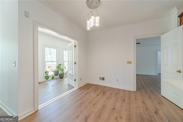 3775 Belle Glade Trl, Snellville, GA 30039 - unfurnished room featuring light wood finished floors, crown molding, and a chandelier
