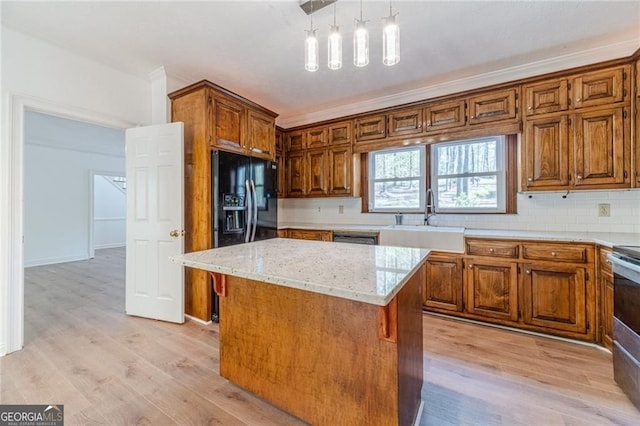 3775 Belle Glade Trl, Snellville, GA 30039 - kitchen featuring decorative backsplash, black refrigerator with ice dispenser, light stone counters, and brown cabinetry