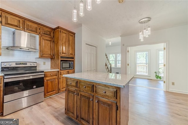 3775 Belle Glade Trl, Snellville, GA 30039 - kitchen featuring appliances with stainless steel finishes, wall chimney exhaust hood, a chandelier, light wood finished floors, and tasteful backsplash