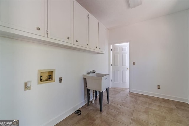 3775 Belle Glade Trl, Snellville, GA 30039 - laundry area with cabinet space, washer hookup, hookup for an electric dryer, and light tile patterned floors