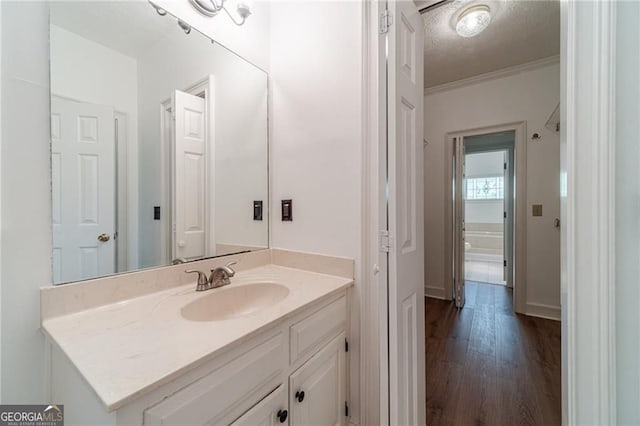 3775 Belle Glade Trl, Snellville, GA 30039 - bathroom with vanity, wood finished floors, and a textured ceiling