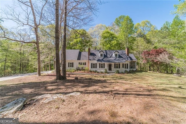 3775 Belle Glade Trl, Snellville, GA 30039 - cape cod-style house featuring a chimney and a porch