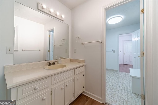 3775 Belle Glade Trl, Snellville, GA 30039 - bathroom with vanity and wood finished floors