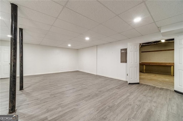 3775 Belle Glade Trl, Snellville, GA 30039 - finished basement with wood finished floors, a paneled ceiling, recessed lighting, and electric panel