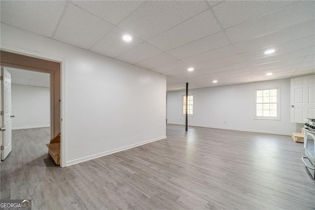 3775 Belle Glade Trl, Snellville, GA 30039 - below grade area with wood finished floors, plenty of natural light, recessed lighting, and a drop ceiling