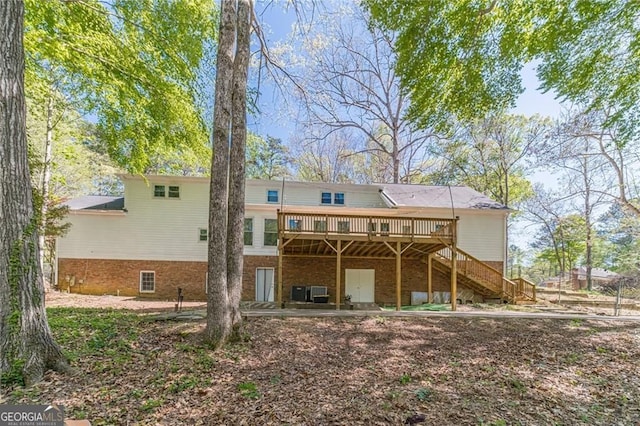 3775 Belle Glade Trl, Snellville, GA 30039 - rear view of property featuring a deck, stairway, and brick siding