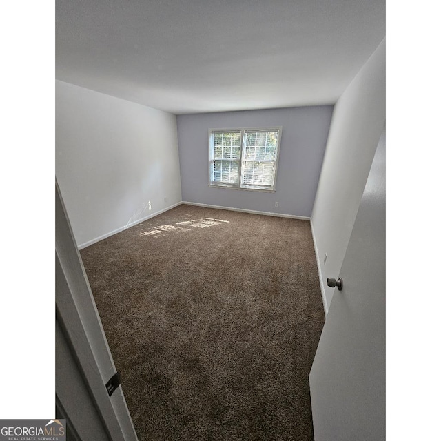 173 Amherst Pl NW, Atlanta, GA 30327 - carpeted spare room featuring baseboards