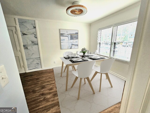 173 Amherst Pl NW, Atlanta, GA 30327 - dining room with crown molding, baseboards, and wood finished floors