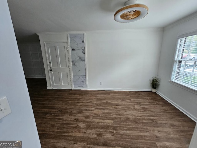 173 Amherst Pl NW, Atlanta, GA 30327 - unfurnished room with baseboards, ornamental molding, and dark wood-style floors