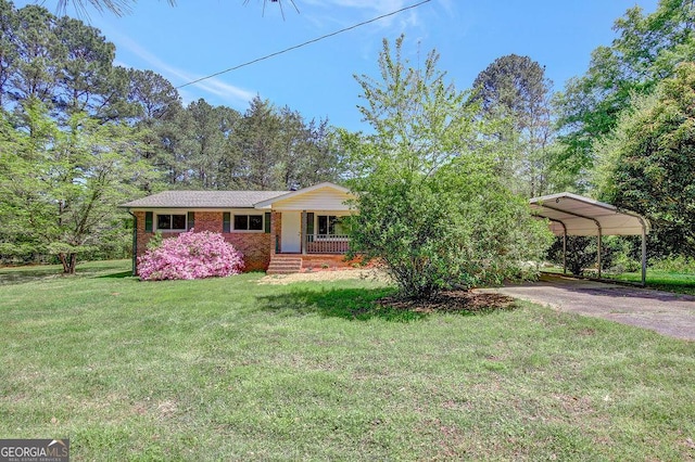 single story home with a front yard, a porch, a detached carport, brick siding, and driveway