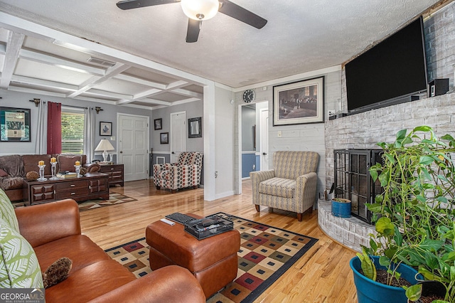 6436 Alpine Rd, Rex, GA 30273 - living area featuring light wood-style floors, visible vents, ceiling fan, and coffered ceiling