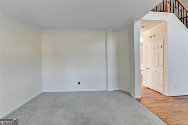 unfurnished room with stairway, ornamental molding, carpet, and baseboards
