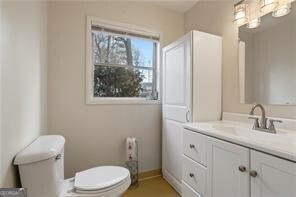 bathroom featuring vanity and toilet