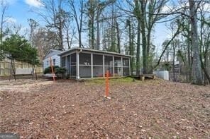 back of house with a sunroom