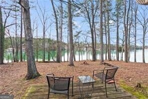 deck featuring a water view
