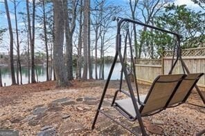 view of jungle gym featuring fence