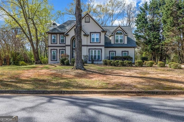 3139 Players Dr, Jonesboro, GA 30236 - view of front of property with stucco siding, a front lawn, and a chimney