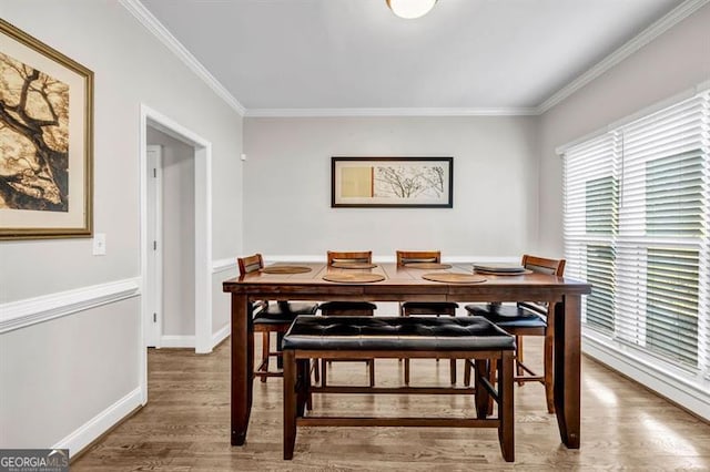 3139 Players Dr, Jonesboro, GA 30236 - dining area with wood finished floors, ornamental molding, and baseboards