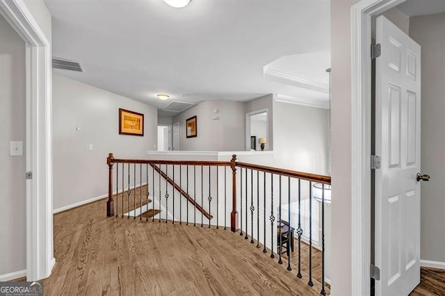 3139 Players Dr, Jonesboro, GA 30236 - hall featuring wood finished floors, an upstairs landing, baseboards, and attic access