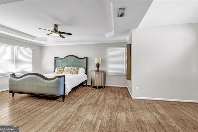 3139 Players Dr, Jonesboro, GA 30236 - bedroom with a raised ceiling, wood finished floors, baseboards, ornamental molding, and a ceiling fan