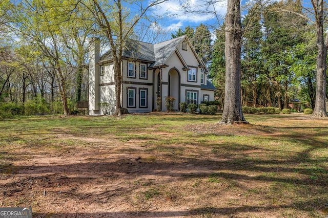 3139 Players Dr, Jonesboro, GA 30236 - tudor house featuring a front lawn and stucco siding