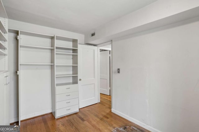 702 Argonne Ave NE Unit 1, Atlanta, GA 30308 - unfurnished bedroom with wood finished floors and a closet