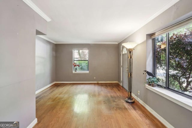 702 Argonne Ave NE Unit 1, Atlanta, GA 30308 - spare room featuring wood finished floors and ornamental molding