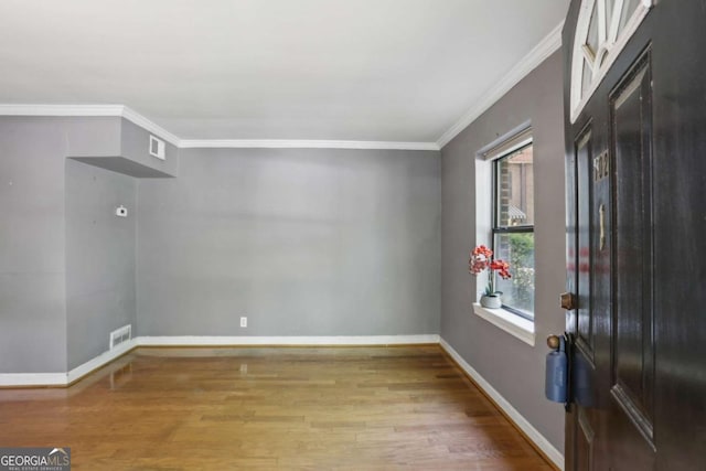 702 Argonne Ave NE Unit 1, Atlanta, GA 30308 - empty room featuring crown molding and wood finished floors