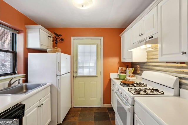 kitchen with white cabinetry, under cabinet range hood, a sink, and white appliances