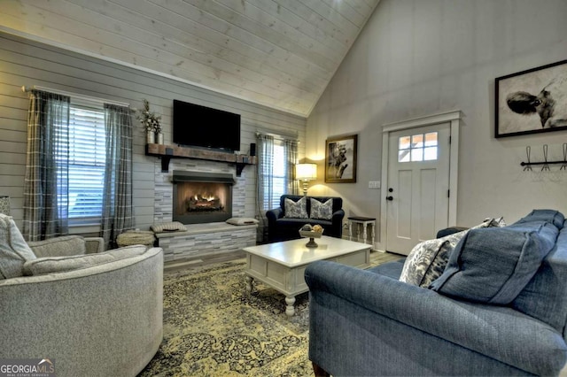 517 Monet Dr Unit 1144R, Ellijay, GA 30540 - living room featuring high vaulted ceiling, a warm lit fireplace, and wood walls