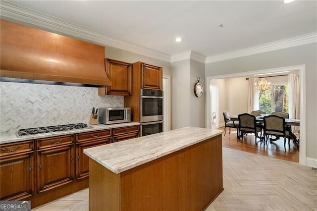 5520 Glen Errol Rd, Atlanta, GA 30327 - kitchen featuring appliances with stainless steel finishes, premium range hood, recessed lighting, backsplash, and ornamental molding