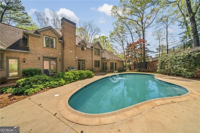 5520 Glen Errol Rd, Atlanta, GA 30327 - view of swimming pool with a patio