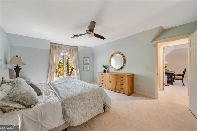 5520 Glen Errol Rd, Atlanta, GA 30327 - bedroom with light colored carpet and a ceiling fan