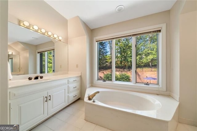 5520 Glen Errol Rd, Atlanta, GA 30327 - bathroom with plenty of natural light, vanity, a bath, and tile patterned floors