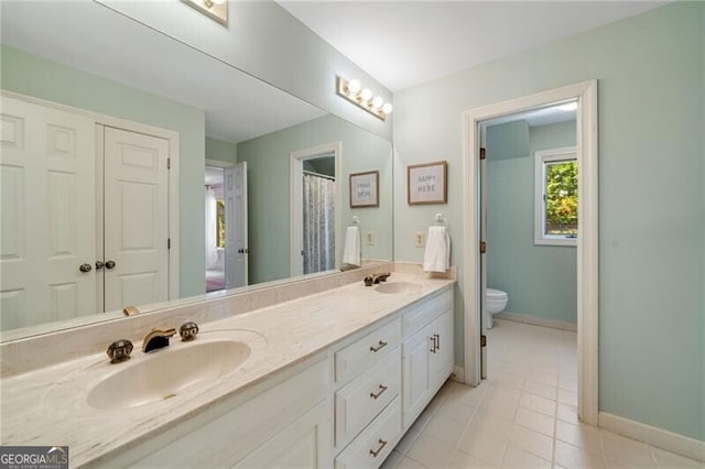 5520 Glen Errol Rd, Atlanta, GA 30327 - full bathroom with double vanity and tile patterned flooring