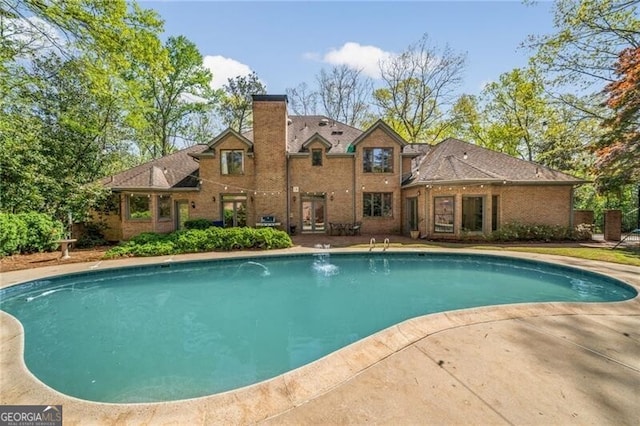 5520 Glen Errol Rd, Atlanta, GA 30327 - outdoor pool featuring french doors