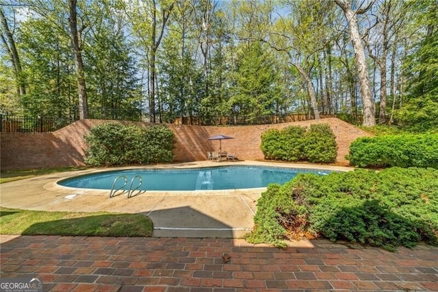 5520 Glen Errol Rd, Atlanta, GA 30327 - view of pool with a fenced backyard, a patio, and view of scattered trees
