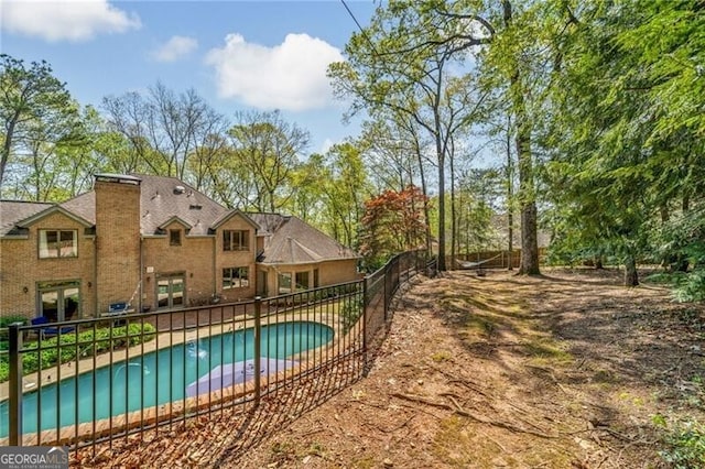 5520 Glen Errol Rd, Atlanta, GA 30327 - view of swimming pool with a patio