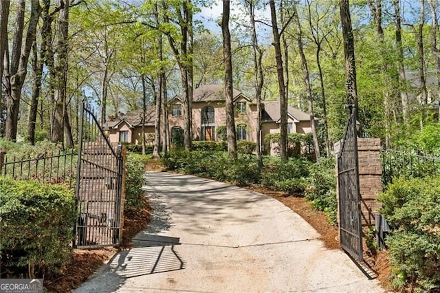 5520 Glen Errol Rd, Atlanta, GA 30327 - view of front of home featuring a gate and asphalt driveway