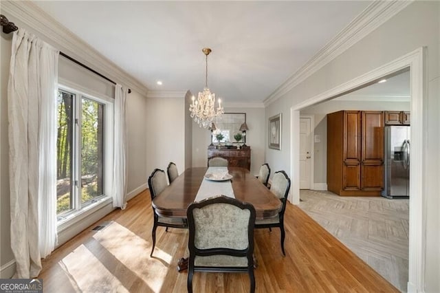 5520 Glen Errol Rd, Atlanta, GA 30327 - dining room with a chandelier, crown molding, and parquet flooring