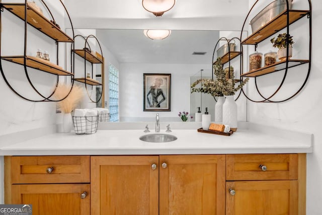 bathroom featuring vanity and visible vents